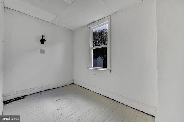 spare room with light hardwood / wood-style floors