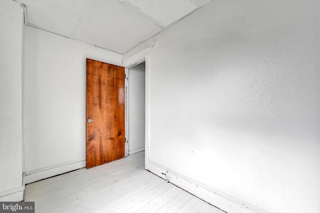 unfurnished room with light hardwood / wood-style flooring