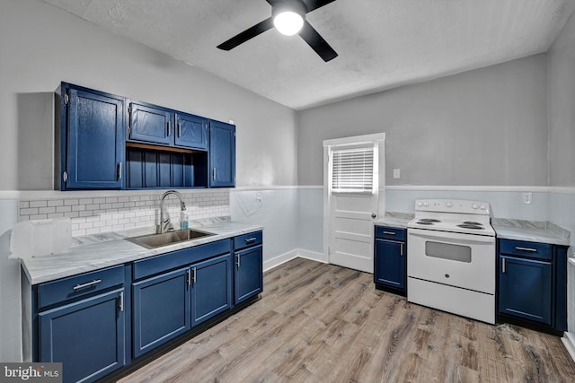 kitchen with sink, blue cabinets, and white electric stove