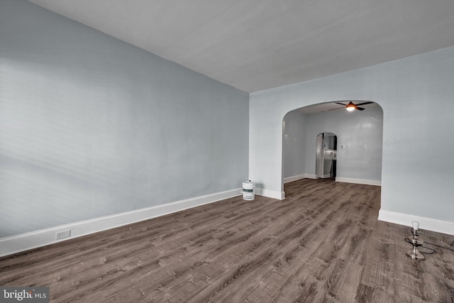 spare room with wood-type flooring and ceiling fan