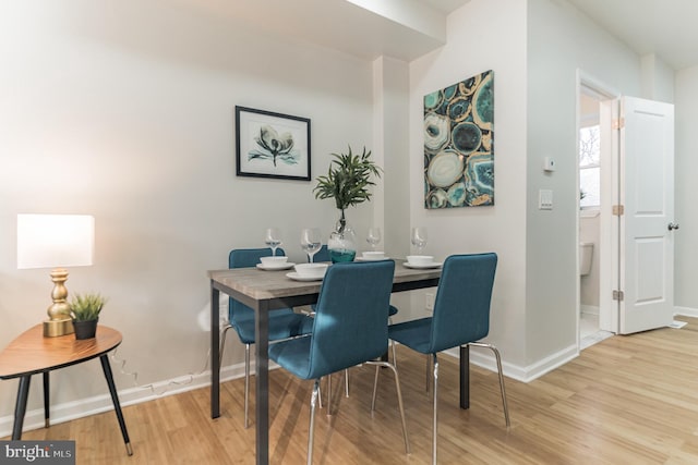 dining space featuring light hardwood / wood-style floors