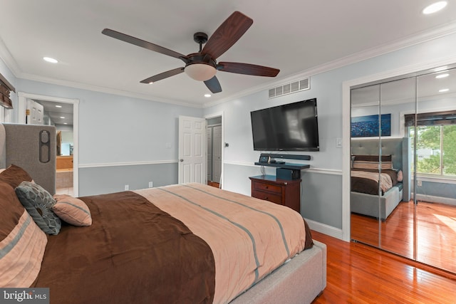 bedroom featuring light wood-type flooring, ceiling fan, and ornamental molding