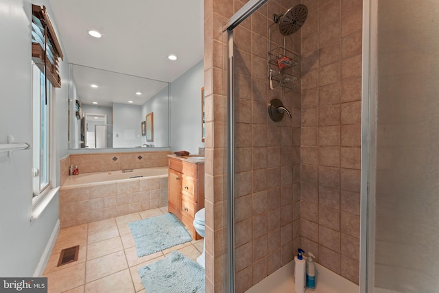 full bathroom with tile patterned flooring, vanity, separate shower and tub, and toilet