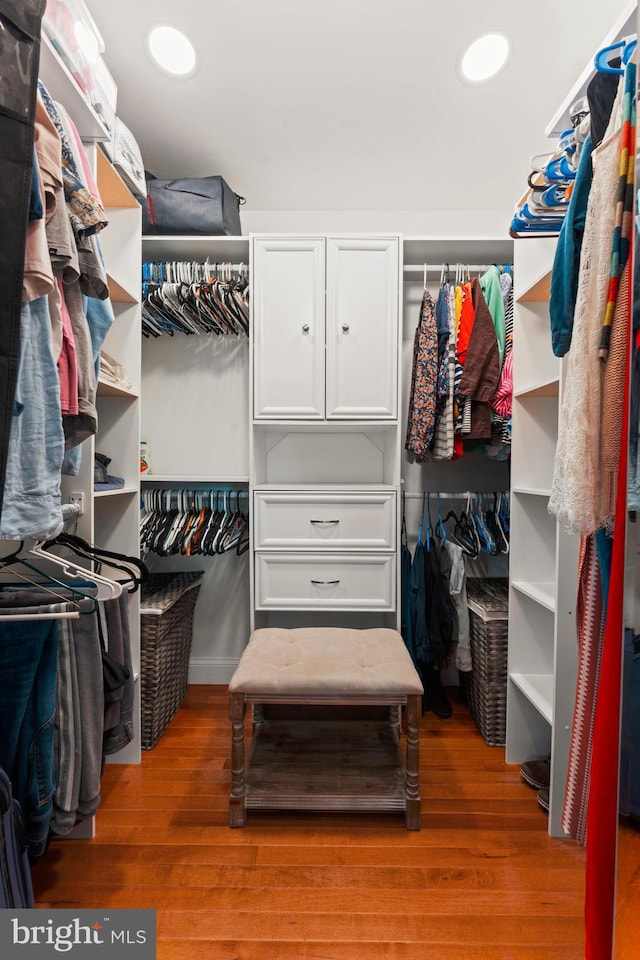 spacious closet featuring hardwood / wood-style flooring