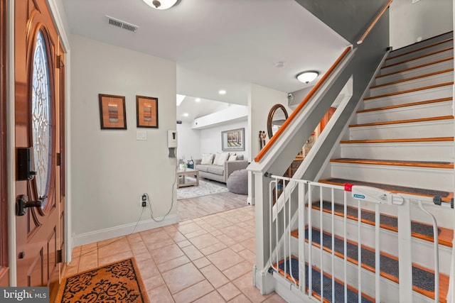 entrance foyer with tile patterned floors