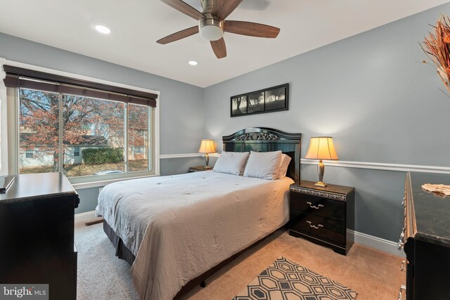 carpeted bedroom featuring ceiling fan