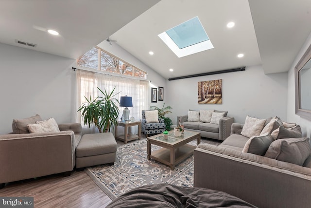 living room featuring ceiling fan, wood-type flooring, and lofted ceiling