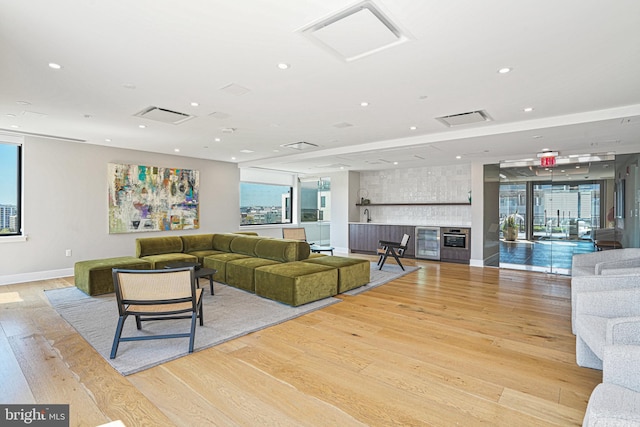 living room with light hardwood / wood-style floors