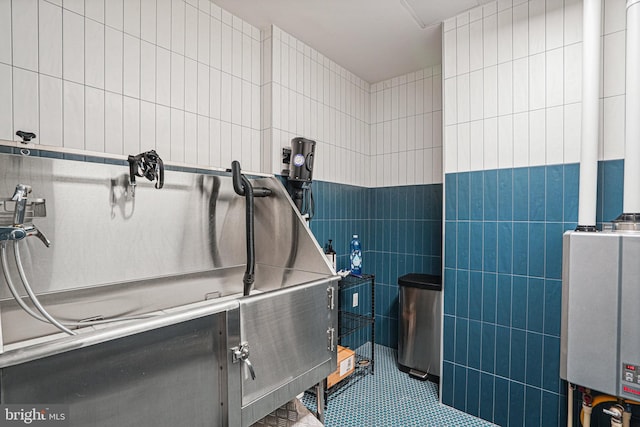 misc room with tile patterned flooring and tile walls