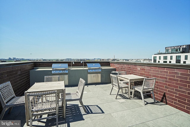 view of patio featuring a grill and exterior kitchen