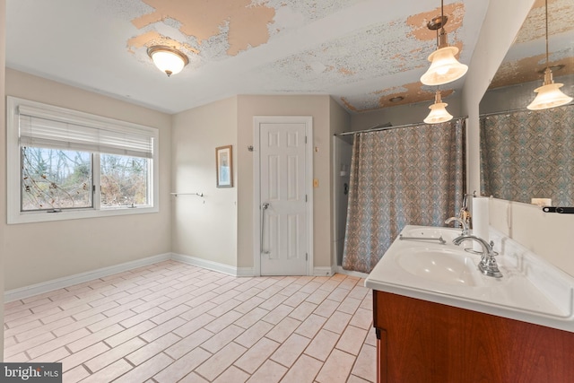 bathroom with vanity and a shower with shower curtain