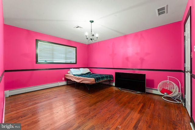 unfurnished bedroom with dark wood-type flooring, a chandelier, and a baseboard heating unit