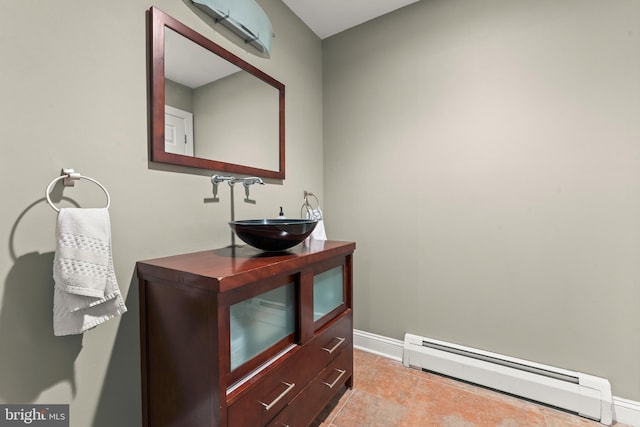 bathroom with vanity and a baseboard radiator