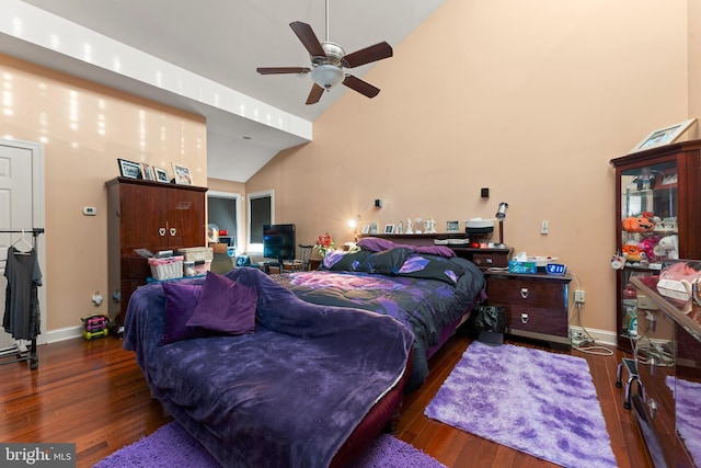 bedroom featuring ceiling fan, dark wood-type flooring, and vaulted ceiling