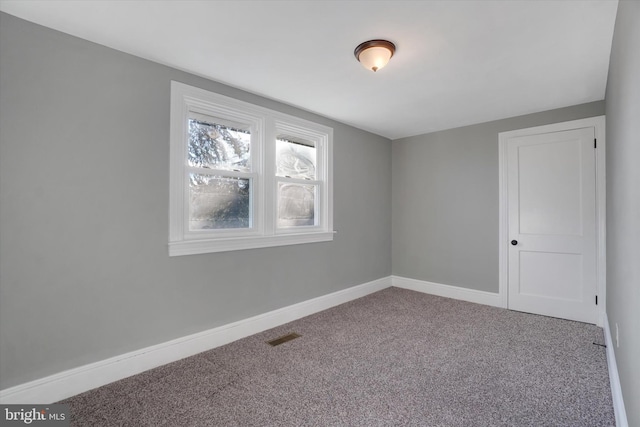 unfurnished room with carpet