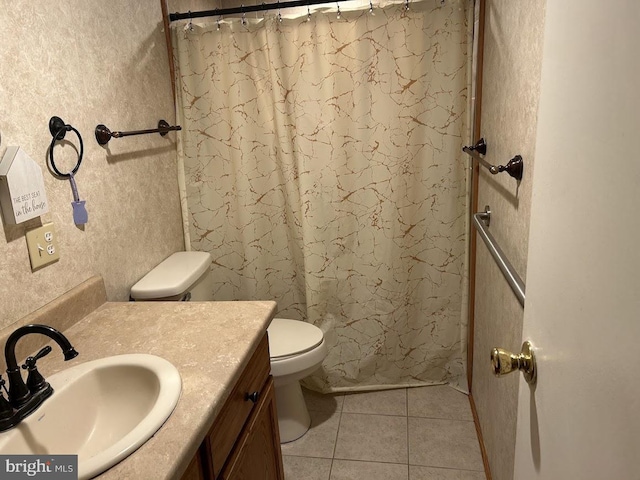 bathroom with tile patterned floors, vanity, a shower with shower curtain, and toilet