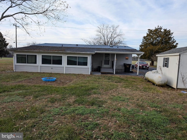 rear view of house with a lawn