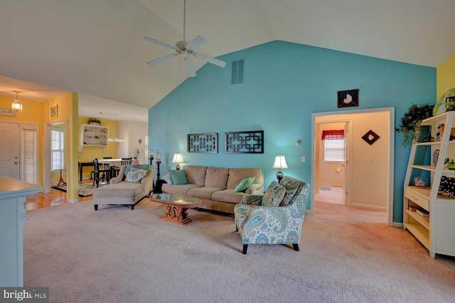 living room featuring light carpet, high vaulted ceiling, and ceiling fan