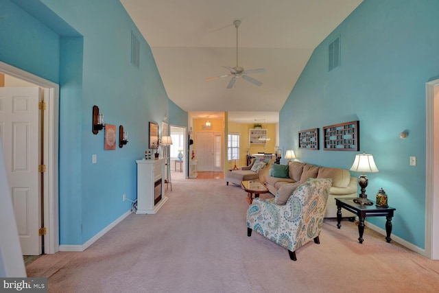 living room featuring light carpet, high vaulted ceiling, and ceiling fan