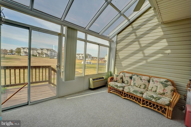 sunroom / solarium featuring ceiling fan and an AC wall unit