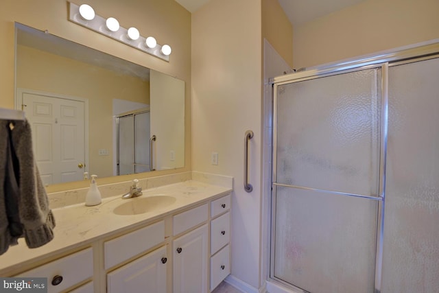 bathroom with vanity and walk in shower