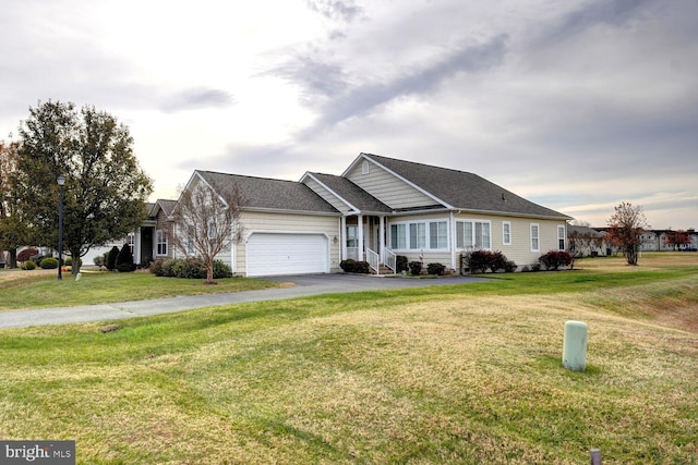 single story home featuring a front yard and a garage