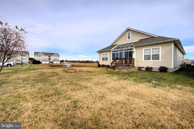 back of house featuring a yard