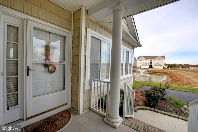 property entrance with covered porch