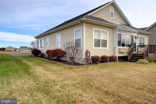 exterior space featuring a deck and a lawn