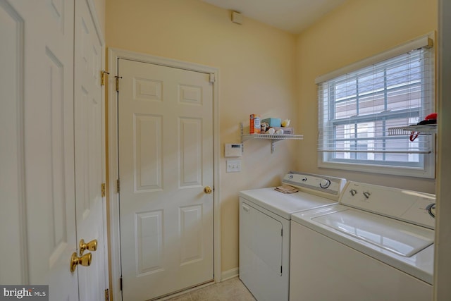 laundry room with washer and clothes dryer