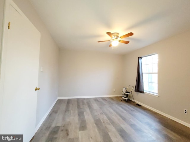 spare room with ceiling fan and light hardwood / wood-style floors