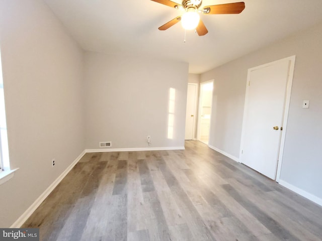 unfurnished room featuring hardwood / wood-style flooring and ceiling fan