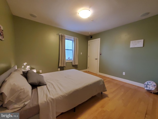 bedroom with light hardwood / wood-style floors