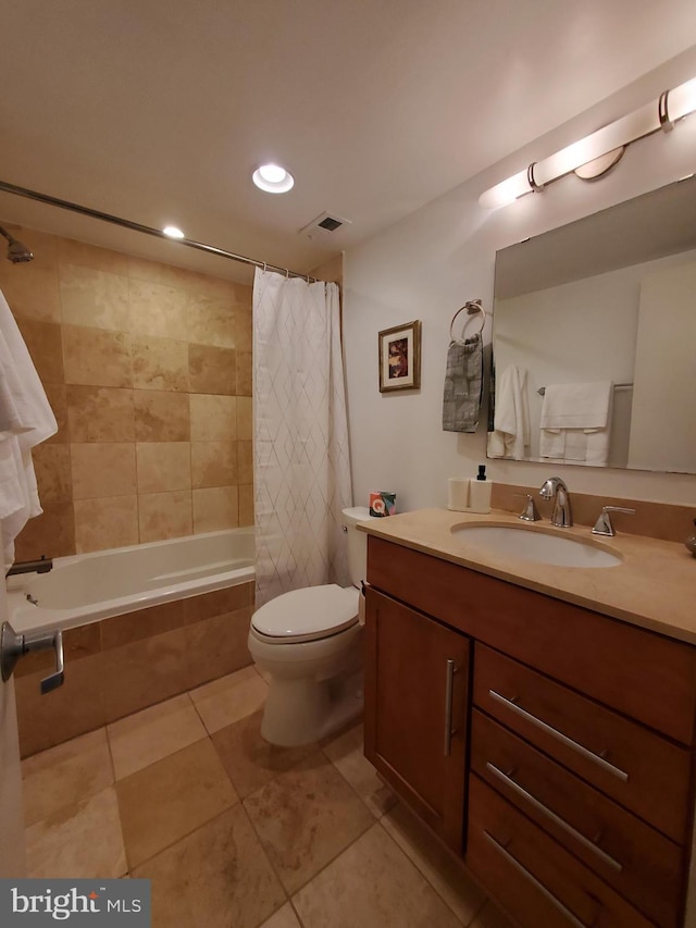 full bathroom with toilet, shower / bath combination with curtain, vanity, and tile patterned floors