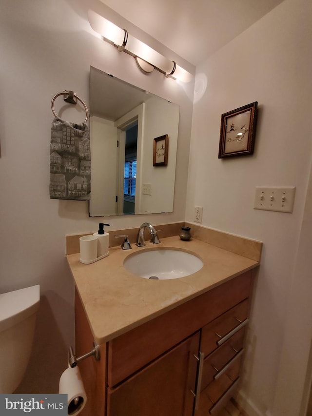 bathroom with vanity and toilet