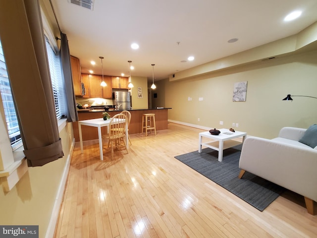 living room with light hardwood / wood-style floors