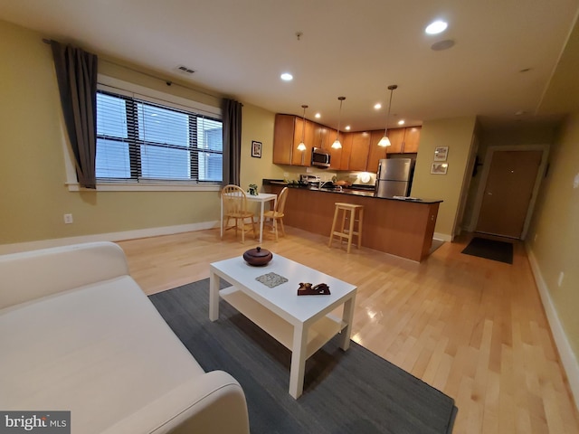 living room featuring light wood-type flooring