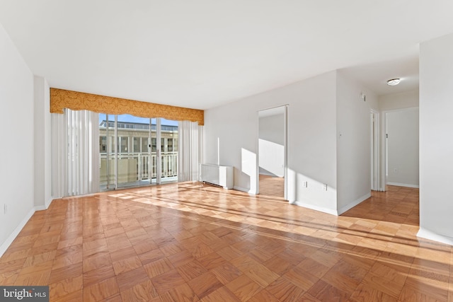 spare room with light parquet flooring