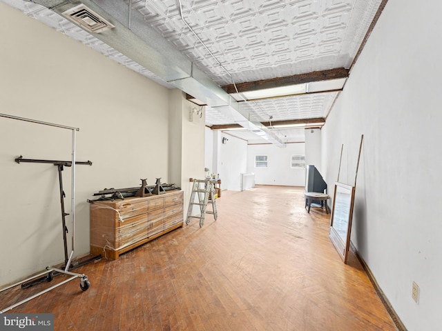 basement featuring hardwood / wood-style flooring