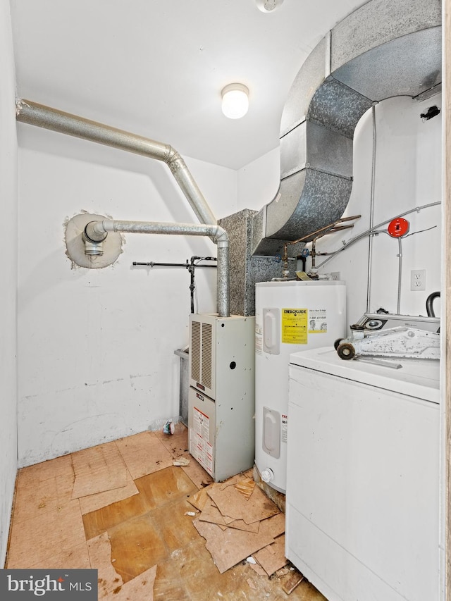 utilities featuring electric water heater and washer / clothes dryer