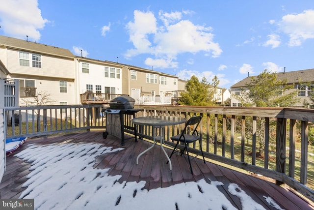 wooden terrace featuring a grill