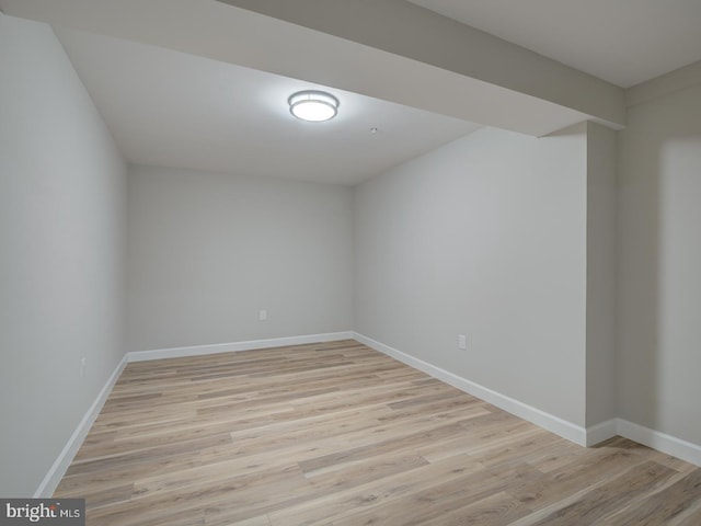 unfurnished room with light wood-type flooring