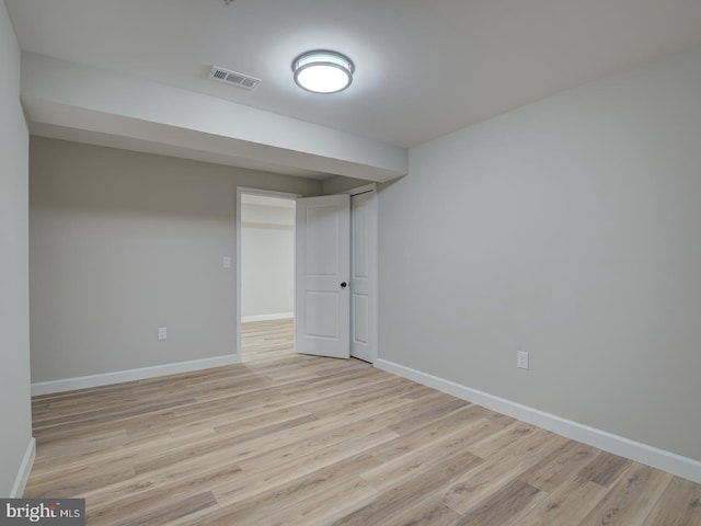 spare room featuring light wood-type flooring