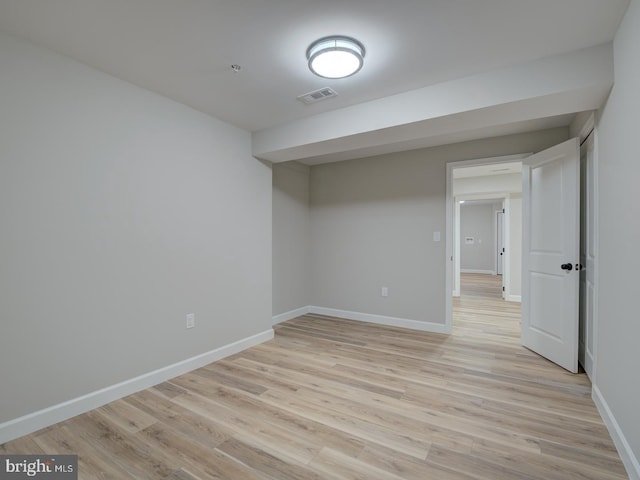 spare room with light wood-type flooring