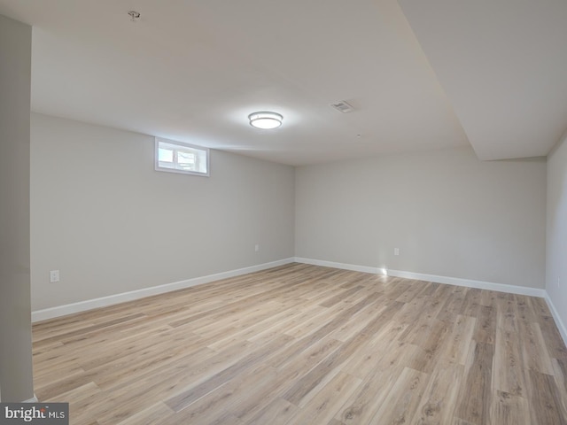 basement featuring light wood-type flooring