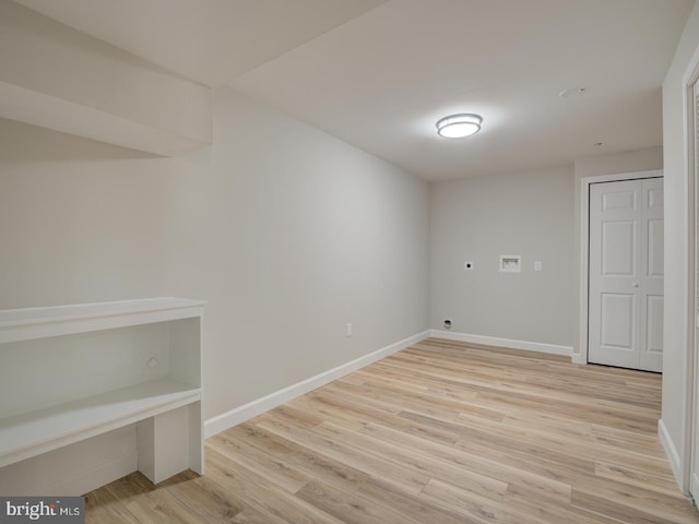 interior space with hookup for an electric dryer, light hardwood / wood-style floors, and hookup for a washing machine