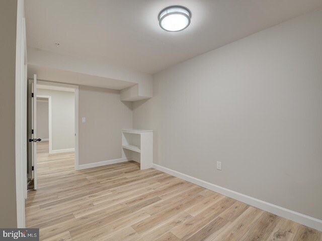 basement featuring light hardwood / wood-style flooring