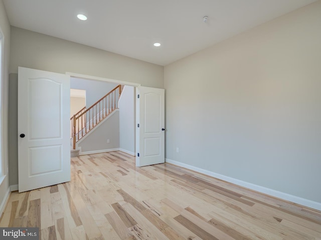 spare room with light hardwood / wood-style floors