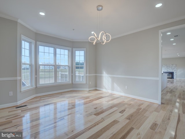 unfurnished room featuring plenty of natural light and light hardwood / wood-style floors