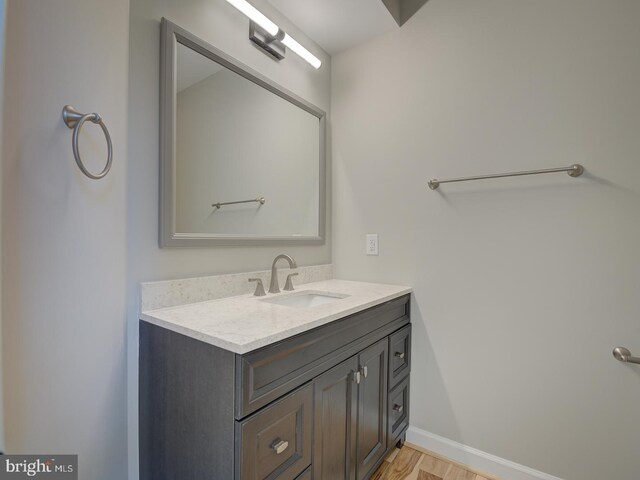 bathroom featuring hardwood / wood-style flooring and vanity